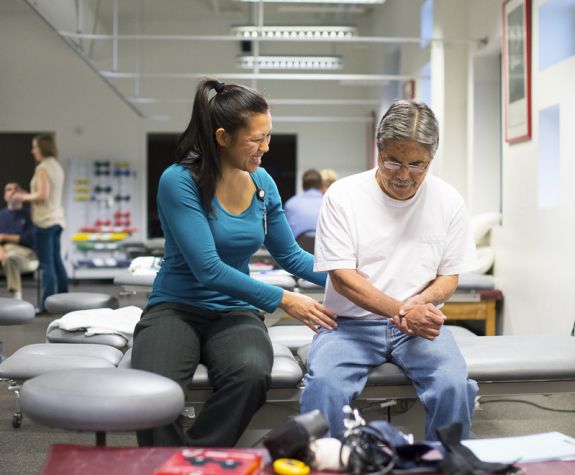 student working with patient
